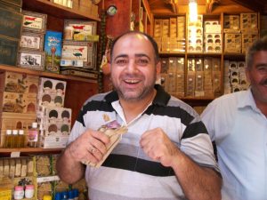 A soap merchant at the souk in Aleppo. This man was an Olympic wrestler.