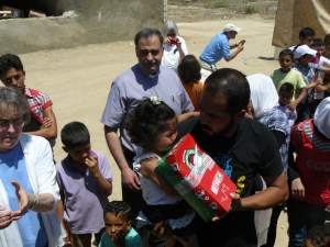 Assis Ramsey from the Presbyterian church in Zahle, Lebanon, ministers to the children in a refugee camp in May, 2013.