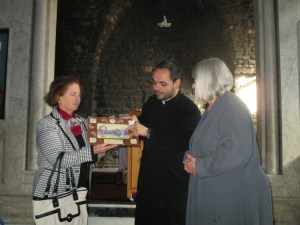 Fr. Ibrahim presents us with the gift of an icon at Notre Dame of the Belt, the Syrian Catholic Church in the old city of Homs, Syria.