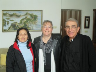 That's me, sandwiched between Huda and Rev. Michel Boughos of Yazdieh, Syria, in their home.
